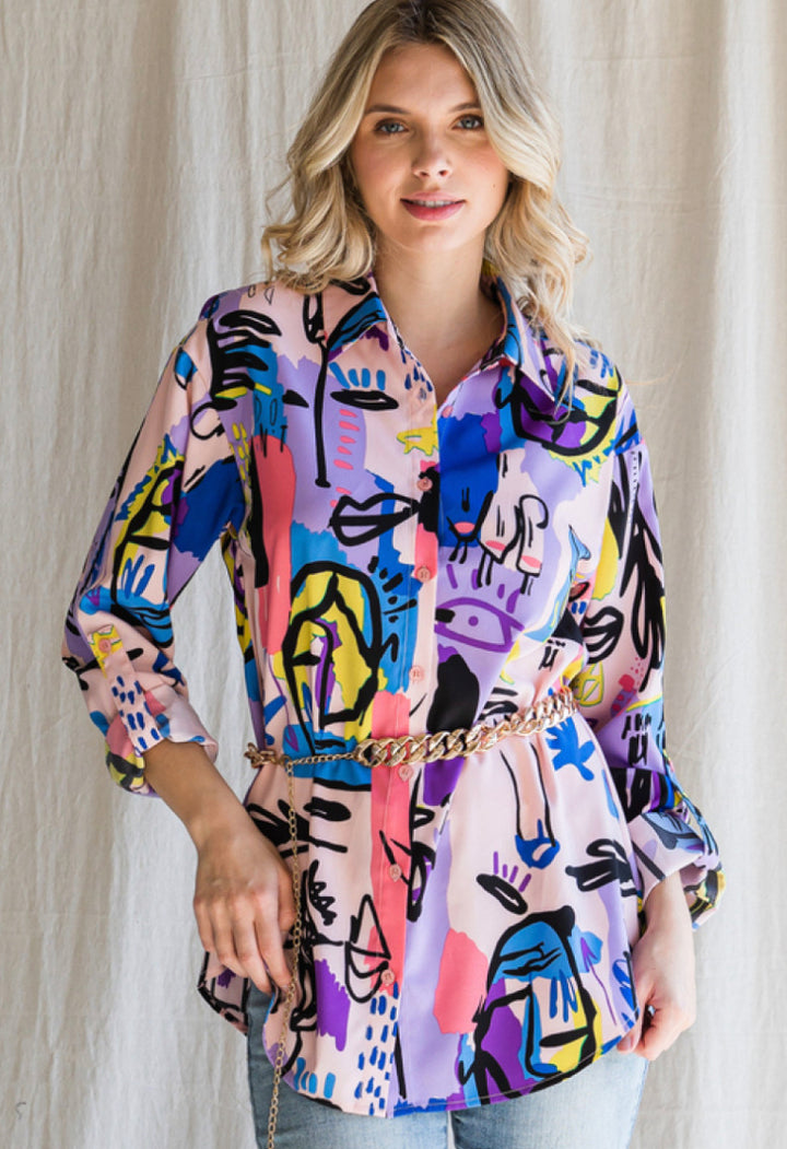 Colorful print top with a collared neck with three quarter roll-up sleeves